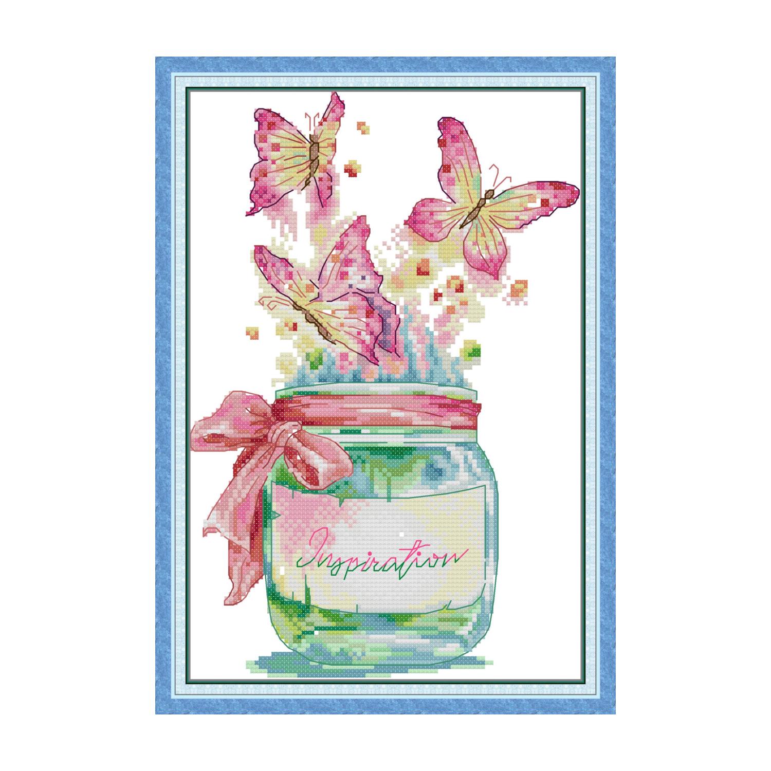 Butterfly cross stitch design of pink butterflies flying from a glass jar labeled "Inspiration" with a pink ribbon bow